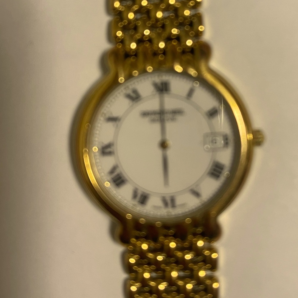Raymond Weil men’s gold plated automatic watch.